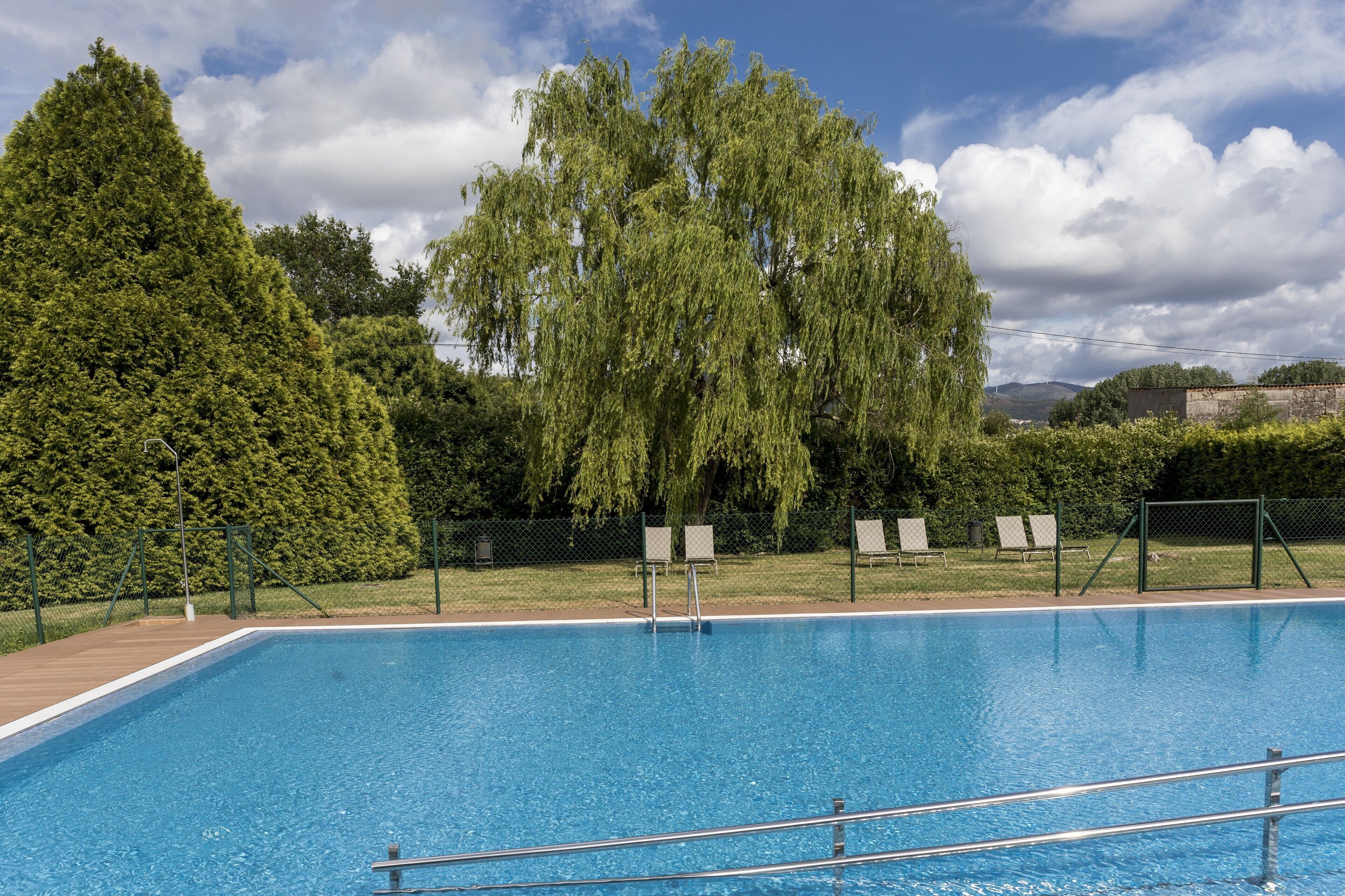 seasonal outdoor pool, pool loungers
