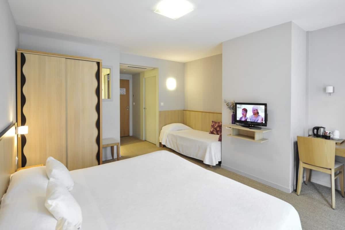 privilege triple room | premium bedding, desk, blackout curtains, soundproofing