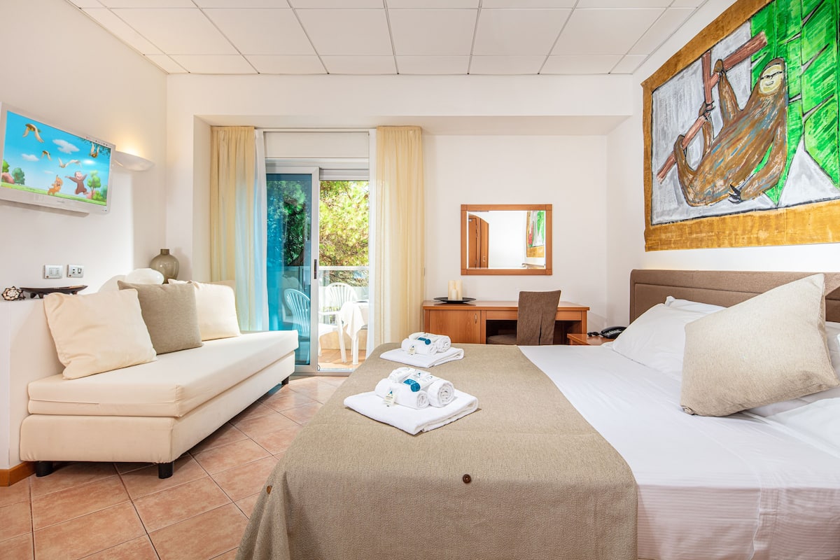 family quadruple room | minibar, in-room safe, desk, blackout curtains