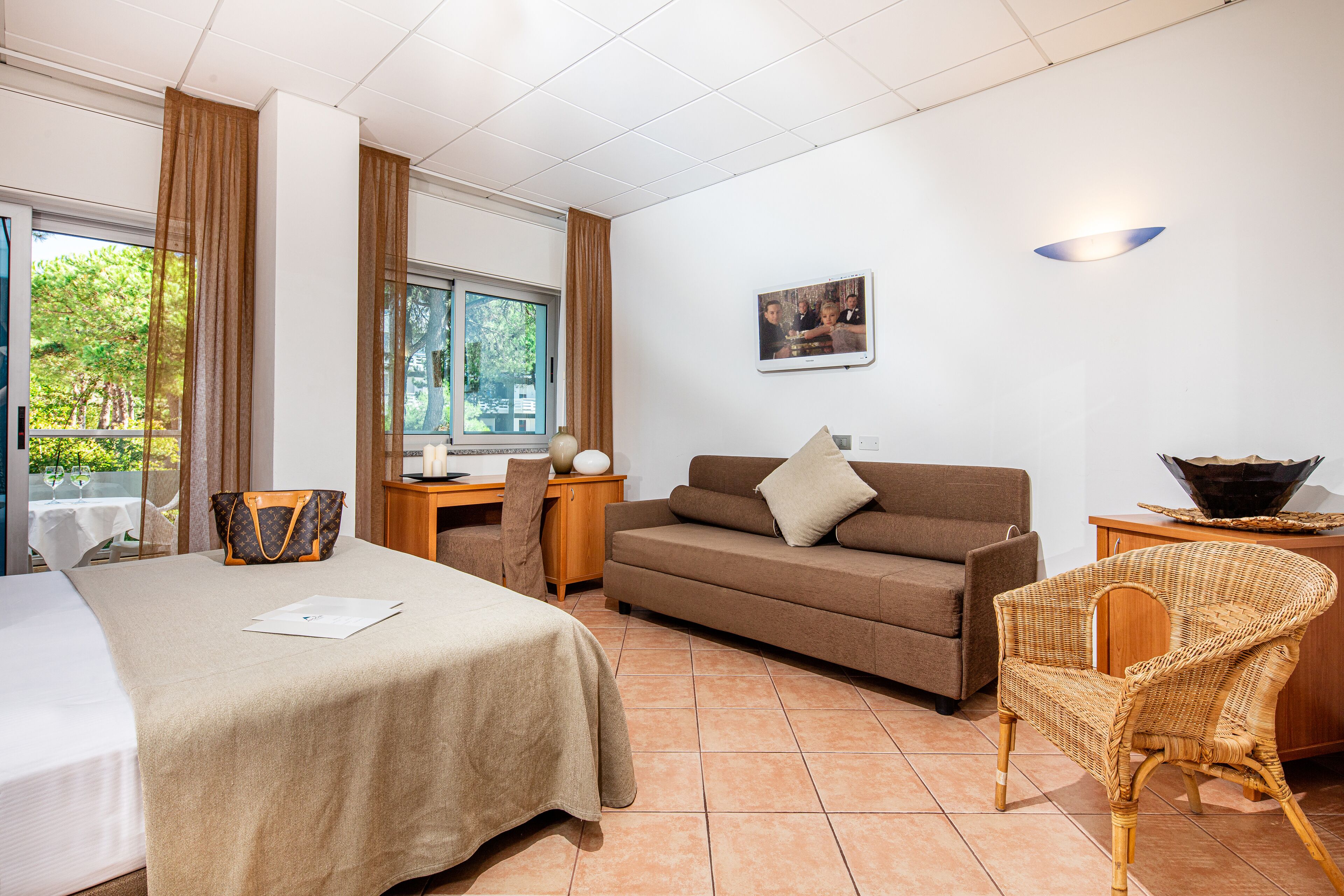 family quadruple room | minibar, in-room safe, desk, blackout curtains