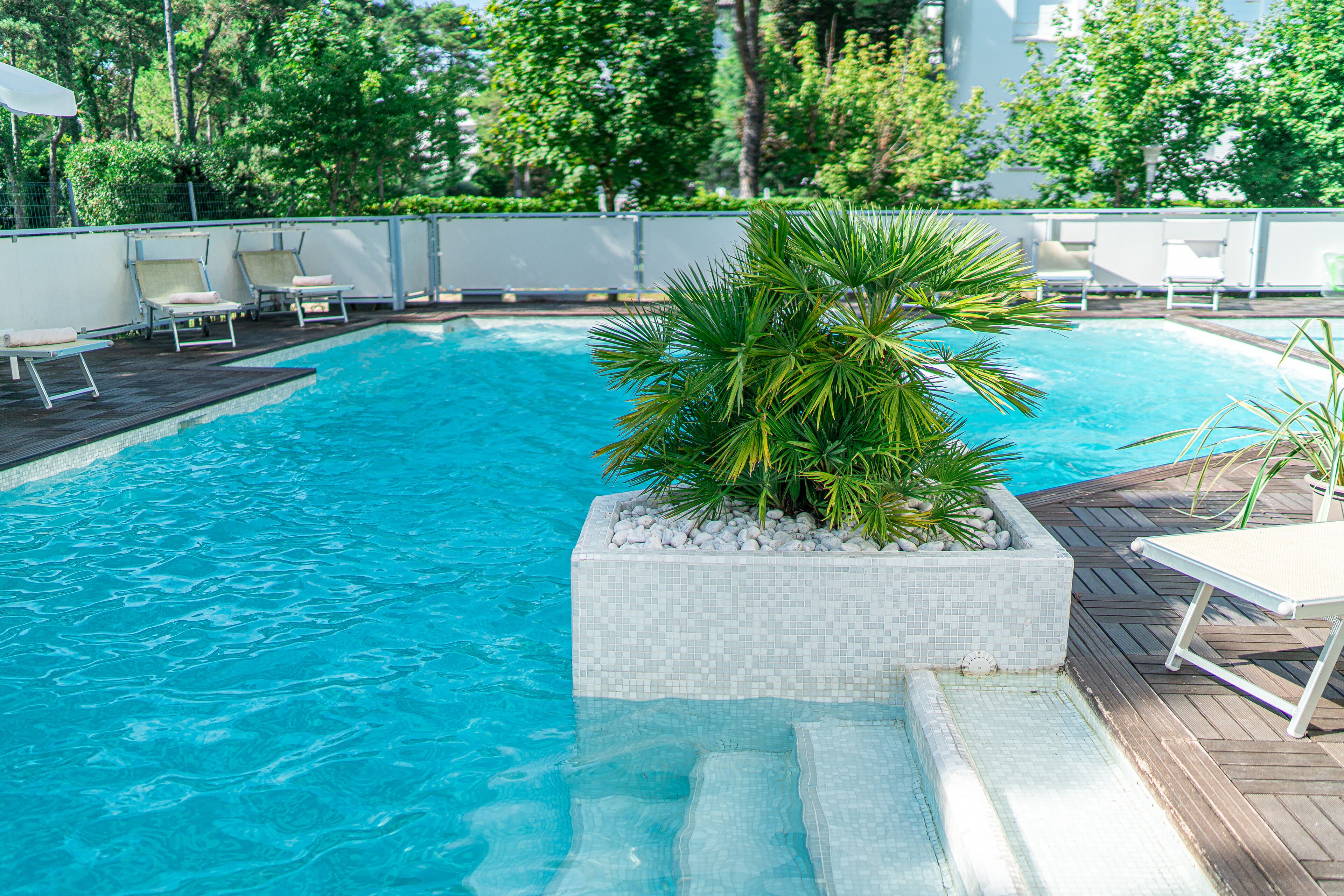 seasonal outdoor pool, pool umbrellas, pool loungers