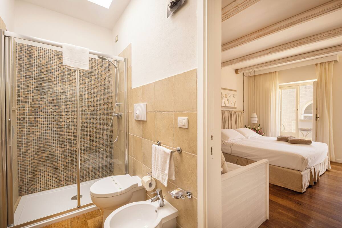 shower, hair dryer, bidet, towels