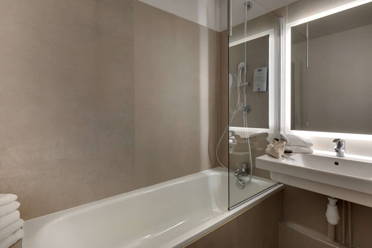 eco-friendly toiletries, hair dryer, towels