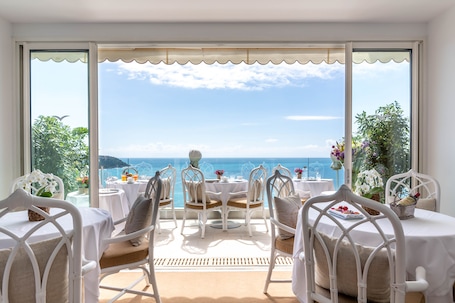 Breakfast, dinner served; Mediterranean cuisine, beach views