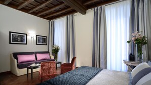 Family Quadruple Room, Multiple Beds | Minibar, in-room safe, desk, blackout drapes - Frattina 122 Guest House (Rome)