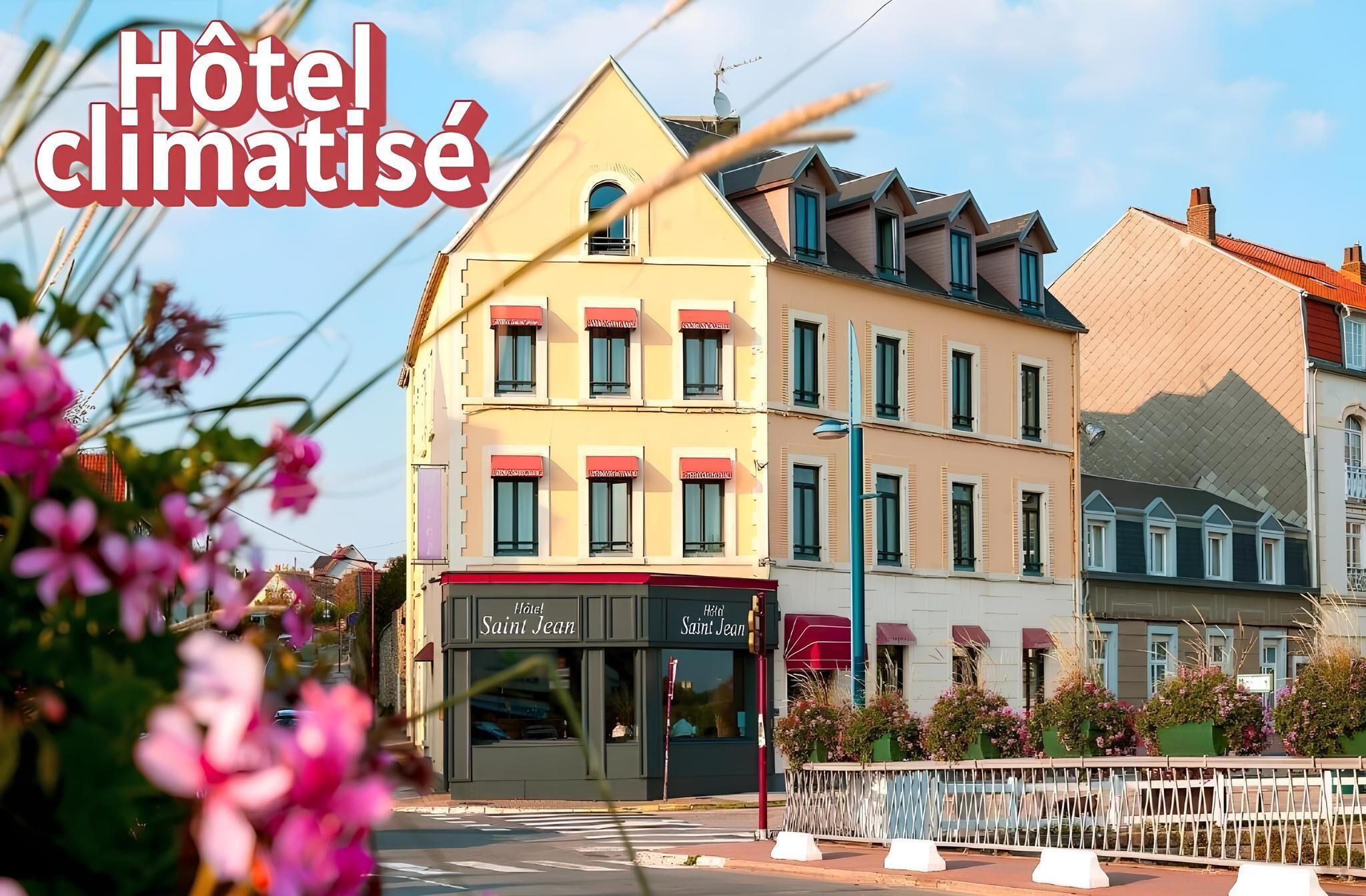 A hotel named 'Hôtel Saint Jean' with a classic European architectural style, featuring a prominent entrance and a balcony with potted plants.