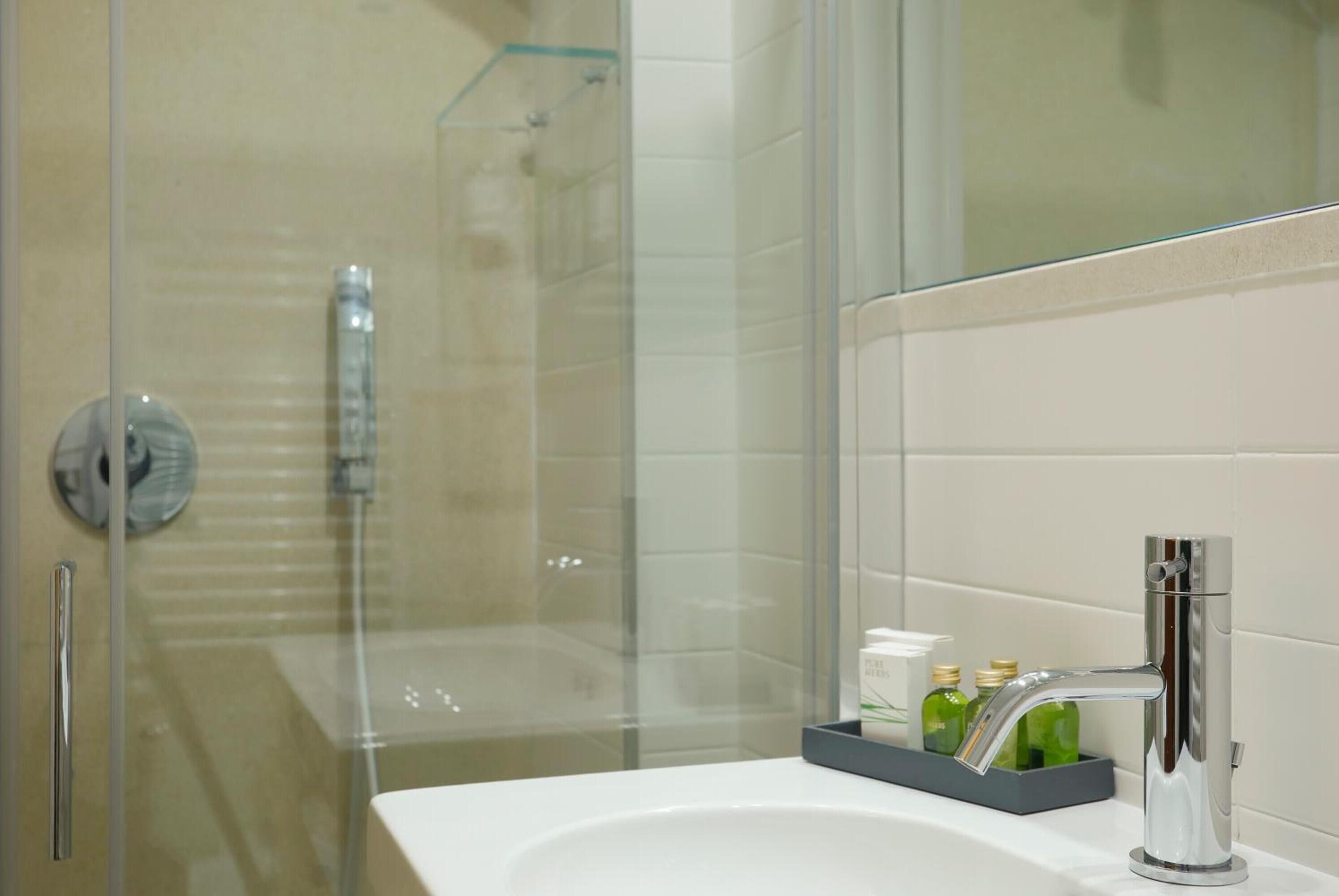 shower, rainfall showerhead, designer toiletries, hair dryer