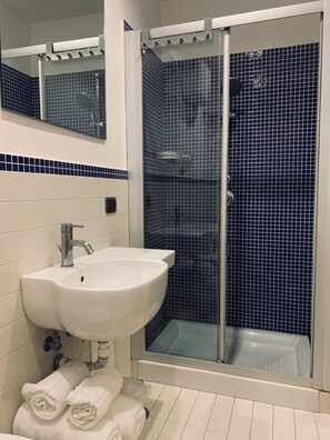 Shower, free toiletries, hair dryer, slippers