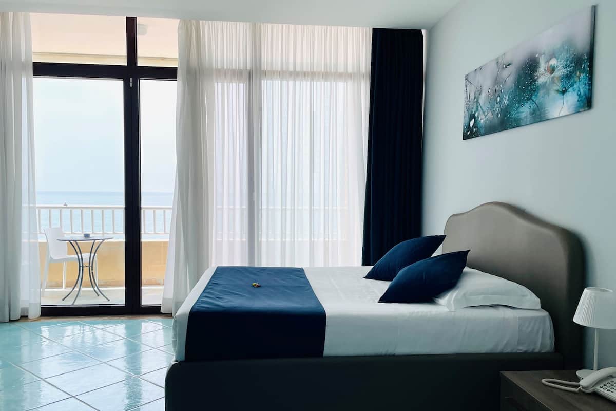 Double Room, Sea View | Down comforters, minibar, in-room safe, individually decorated