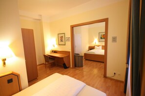 Triple Room | Minibar, in-room safe, desk, soundproofing