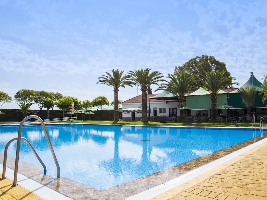 Seasonal outdoor pool, open 11:00 AM to 8:00 PM, pool umbrellas