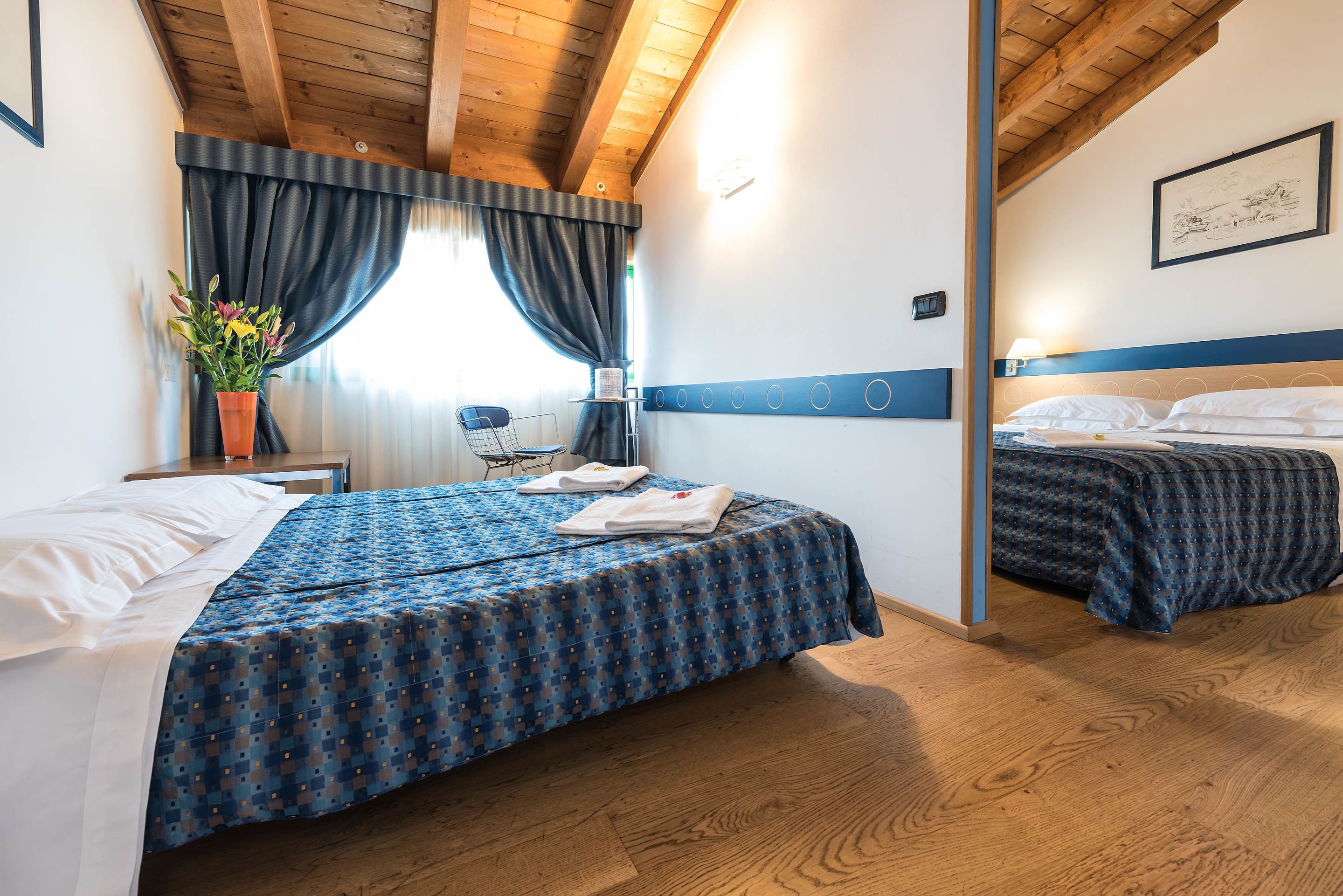 family room | 1 bedroom, minibar, in-room safe, desk