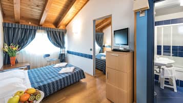 Family Room | 1 bedroom, minibar, in-room safe, desk