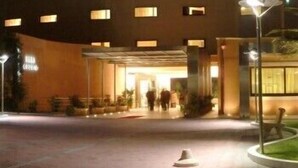 A modern hotel entrance with a covered walkway and a well-lit facade. - Hotel Cecere (Mottola)