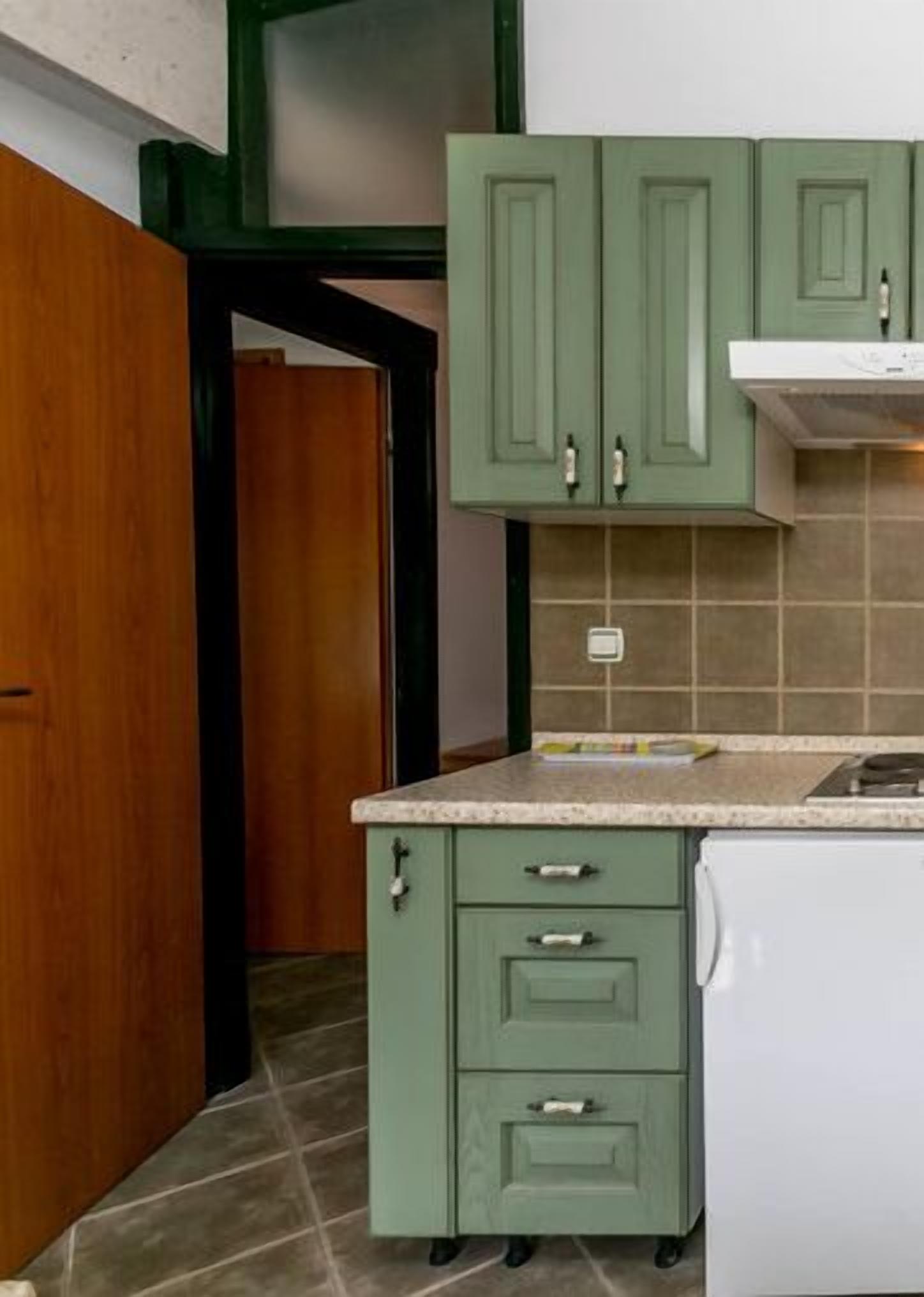 family cottage, multiple beds, garden view | private kitchenette | coffee/tea maker, electric kettle, cleaning supplies, paper towels