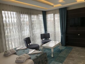 Family Studio Suite, 2 Bedrooms | Living room | 80-cm TV with satellite channels - Venus Hotel (Denizli)