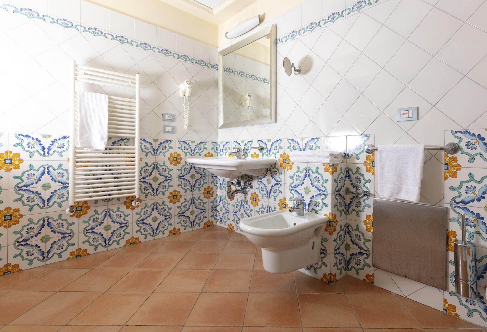 superior studio suite | bathroom | shower, rainfall showerhead, eco-friendly toiletries, hair dryer