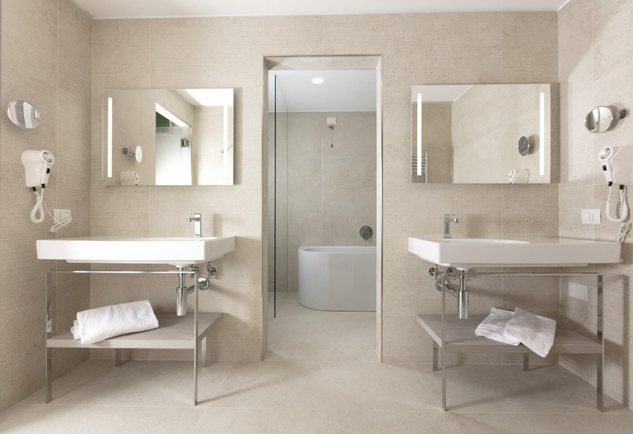 junior suite | bathroom | shower, rainfall showerhead, eco-friendly toiletries, hair dryer