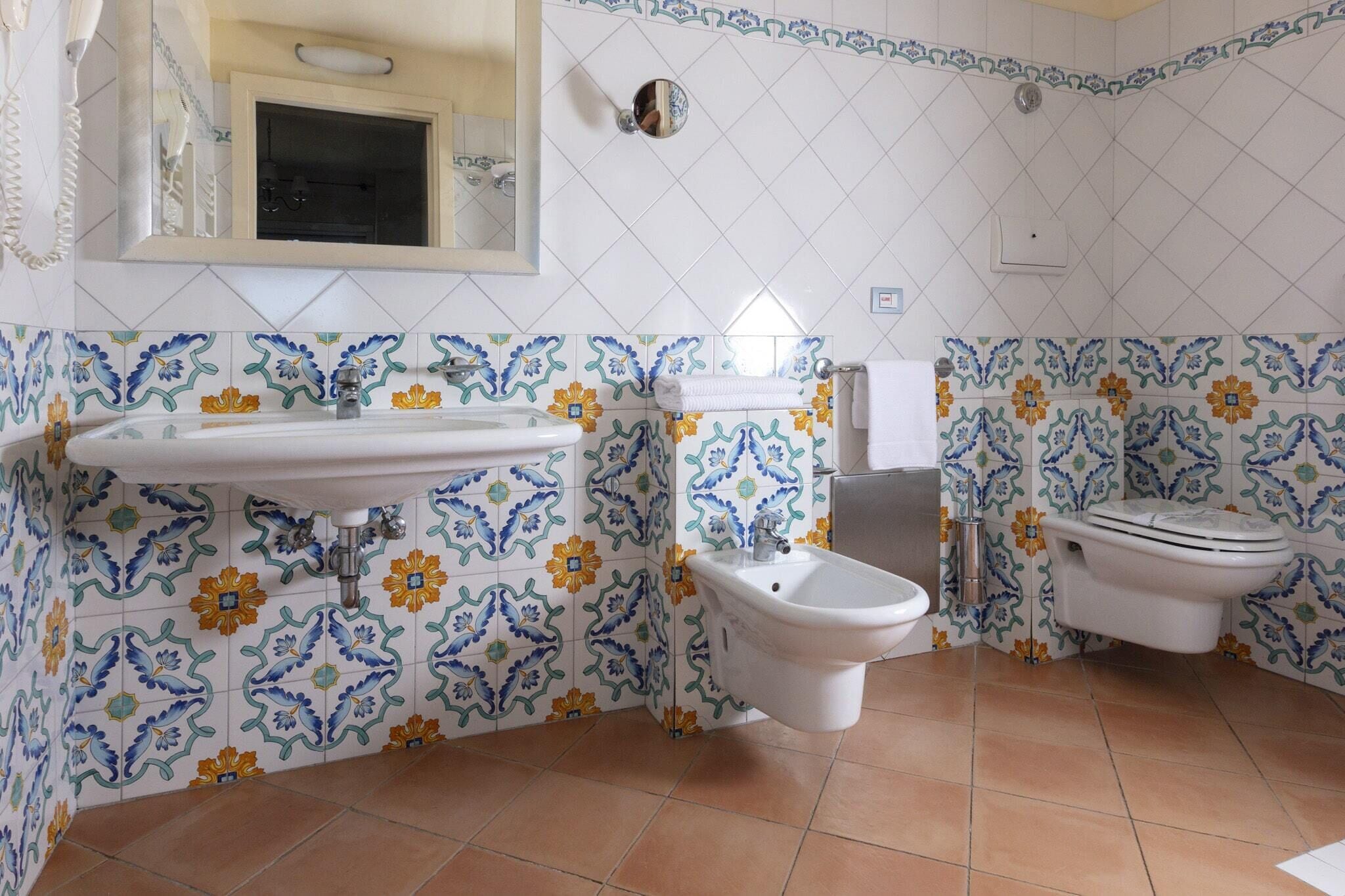 superior studio suite | bathroom | shower, rainfall showerhead, eco-friendly toiletries, hair dryer