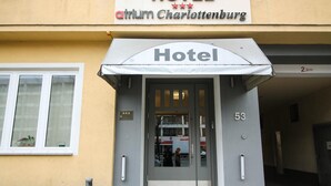 A hotel entrance with a sign reading "HOTEL atrium Charlottenburg" and the number "53" on the door. - Hotel Atrium Charlottenburg (Berlin)