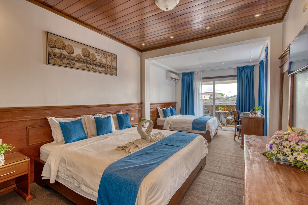 Deluxe Quadruple Room | Premium bedding, in-room safe, desk, laptop workspace