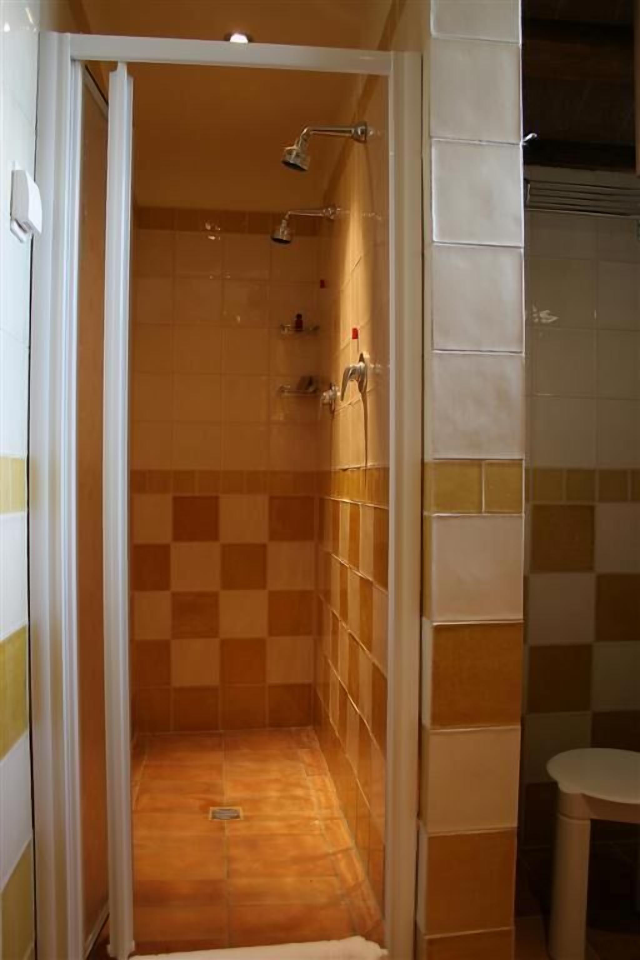 deluxe triple room | bathroom | shower, free toiletries, hair dryer, bidet