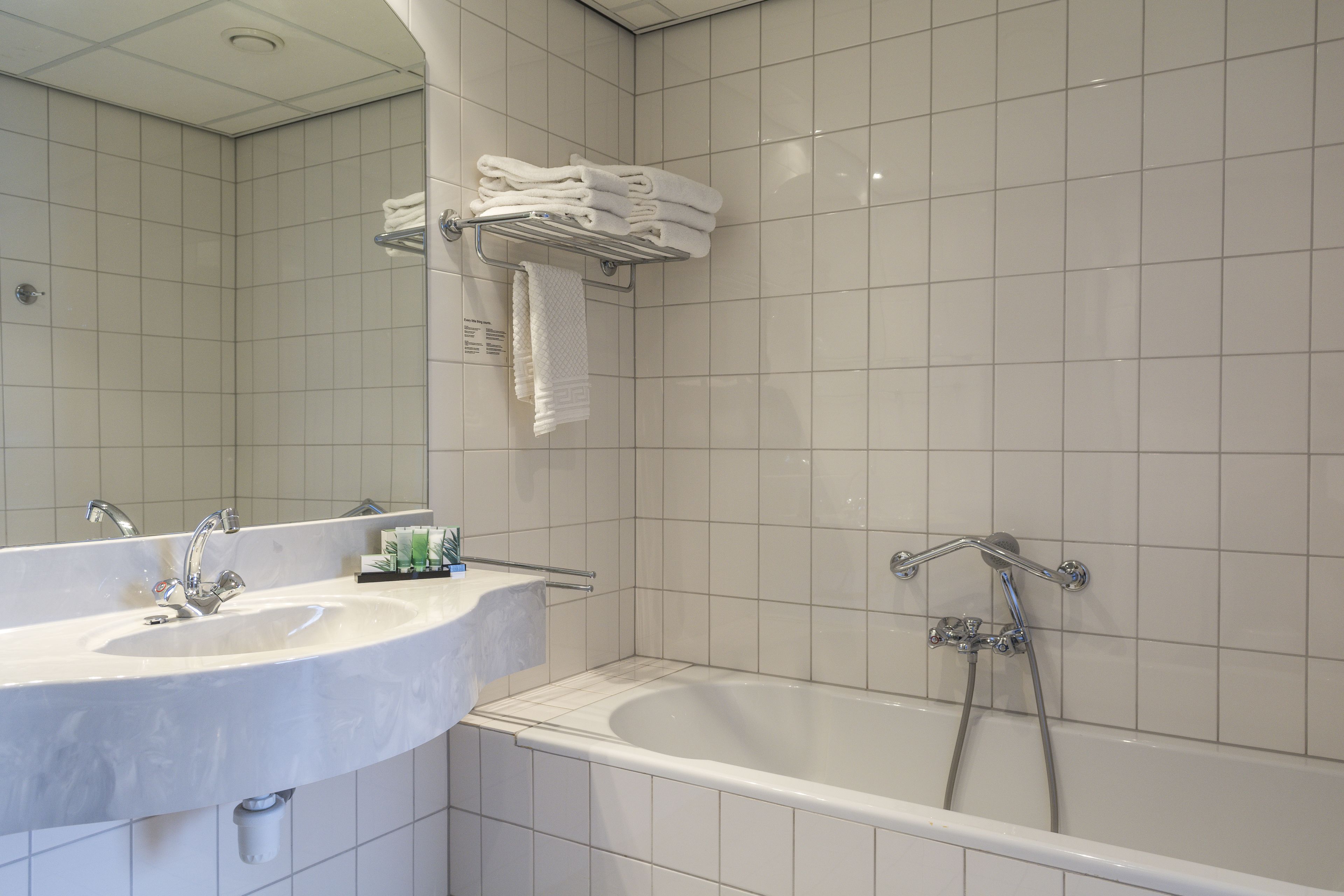 deluxe double room | bathroom | hair dryer, towels
