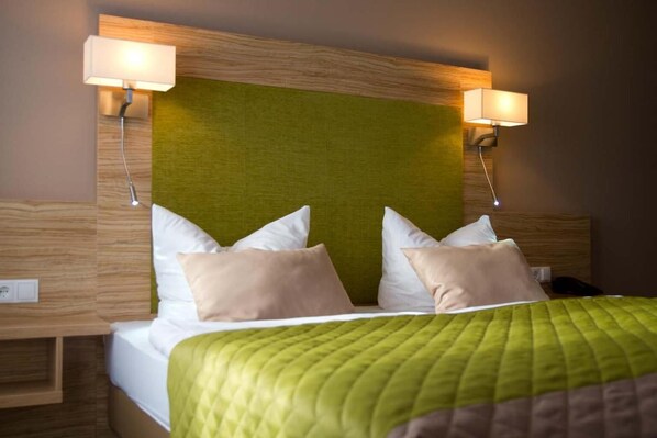 Ropa de cama de alta calidad y camas con pillow-top 