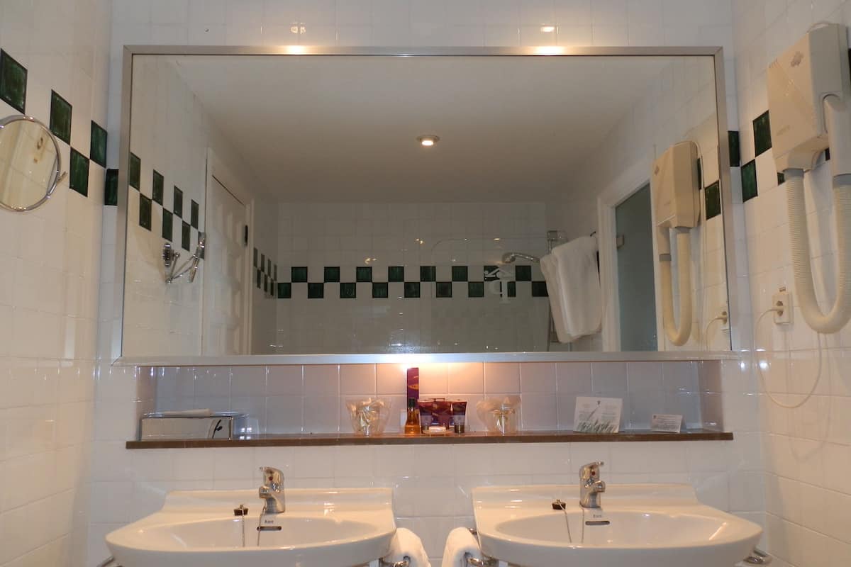 bathtub, eco-friendly toiletries, hair dryer, bidet