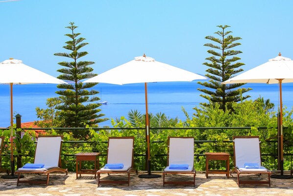 Seasonal outdoor pool, pool umbrellas, pool loungers