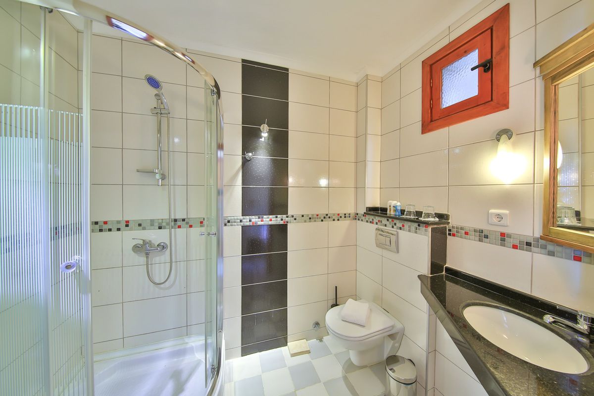 junior suite, 1 bedroom, garden view | bathroom | shower, free toiletries, hair dryer, slippers