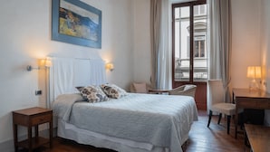 A bedroom with a bed, bedside tables, a chair, and a desk. - Il Salotto di Firenze (Florence)