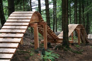 A wooden structure resembling a staircase in a forest. - Hotel Die Tanne (Goslar)