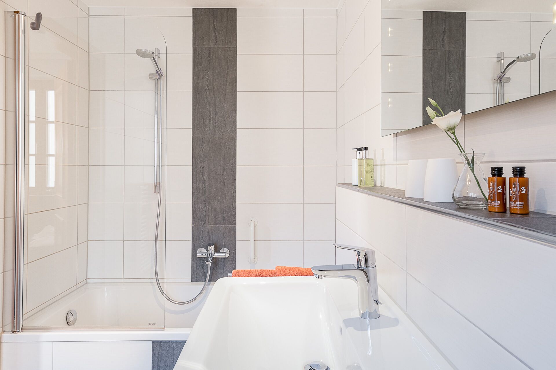 bathtub, free toiletries, hair dryer, towels