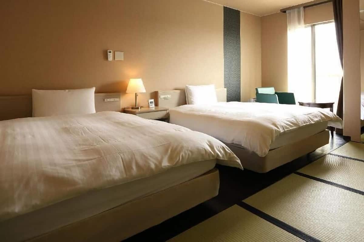 Premium bedding, down comforters, blackout drapes, free WiFi