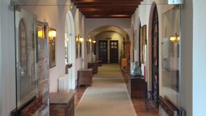 A corridor with arched ceilings and a central walkway.