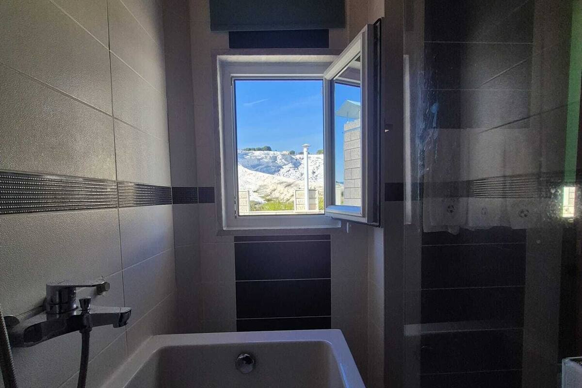 panoramic quadruple room, multiple beds, terrace, poolside | bathroom | combined shower/bathtub, hair dryer, slippers, towels