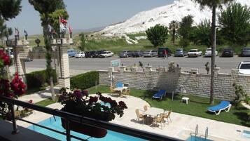 Outdoor pool, pool umbrellas, sun loungers