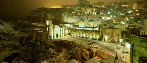 A model of a town with a prominent church and a castle-like structure on a hill.