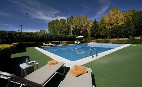 Seasonal outdoor pool, open 11:30 AM to 8:30 PM, pool umbrellas