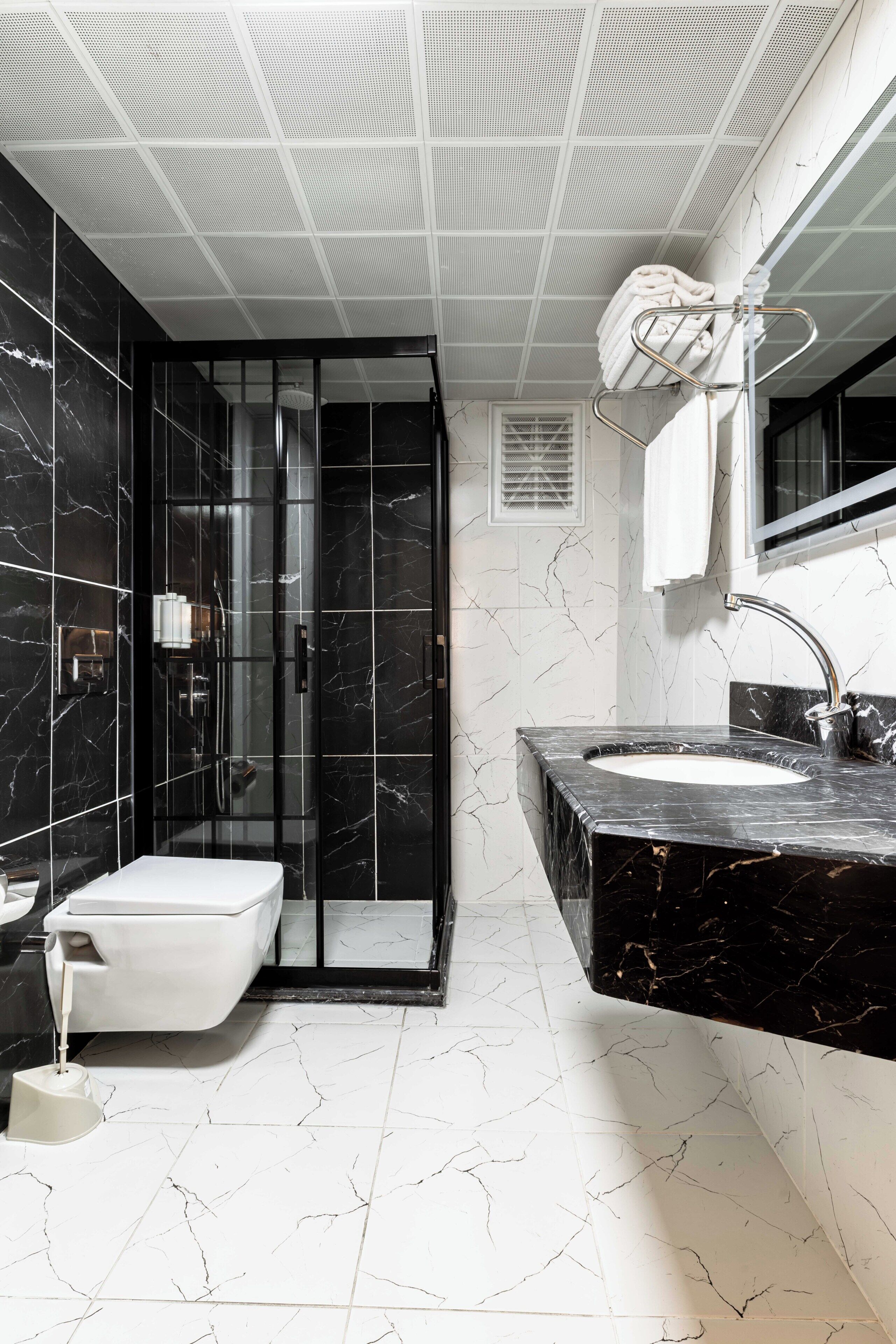 Shower, hair dryer, slippers, towels
