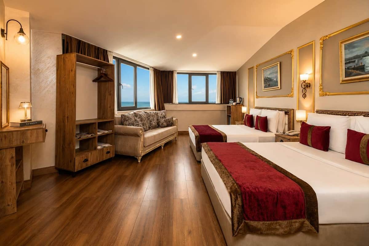 Deluxe Quadruple Room | Premium bedding, minibar, in-room safe, desk