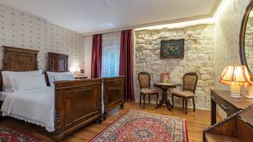 Standard Double Room | Minibar, in-room safe, individually decorated, blackout drapes