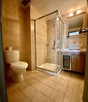 Shower, free toiletries, hair dryer, slippers