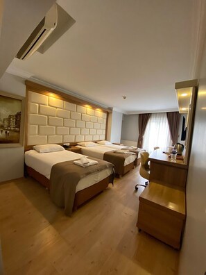 Family Room, 3 Twin Beds | Minibar, in-room safe, desk, soundproofing - Kafkas Hotel (Istanbul)