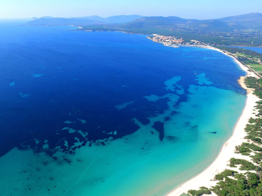 Beach nearby, white sand, sun loungers