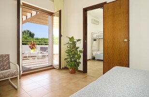 Quadruple Room | Minibar, in-room safe, desk, laptop workspace