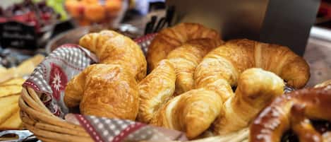 A basket of croissants and other pastries.