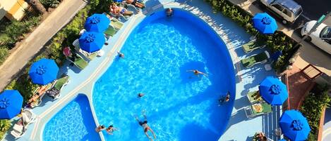 Seasonal outdoor pool, pool loungers