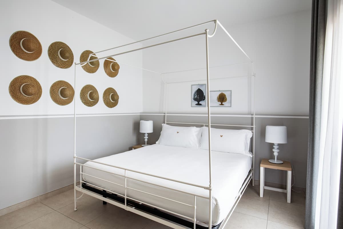 Suite | 1 dormitorio, ropa de cama de alta calidad, minibar y caja fuerte